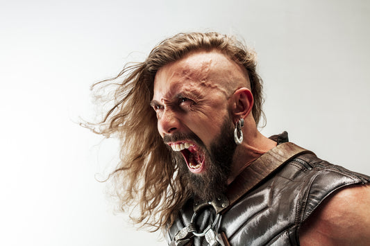 A viking warrior wearing a viking earrings.